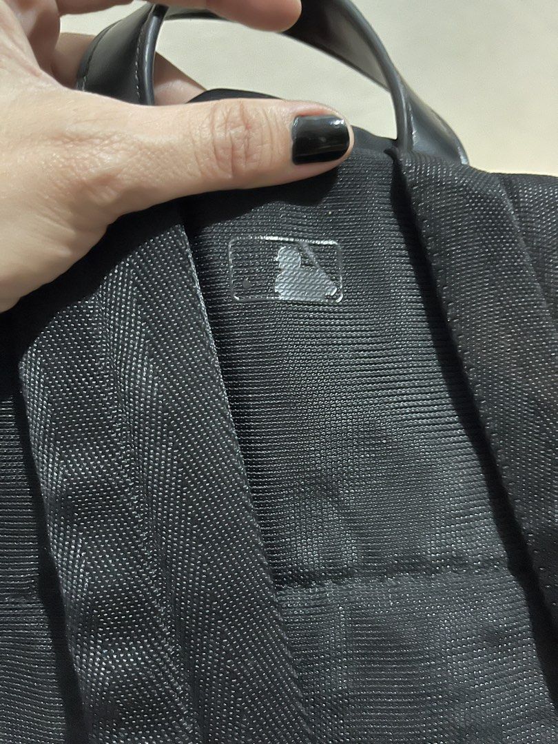 MLB x Disney Mickey Mouse LA Dodgers Black Backpack (Category: Backpacks) located in Talisay. Submitted by cherylu (Listing ID 1466508607, Image 3). Description: MLB x Disney collaboration backpack in black nylon. Features Mickey Mouse graphic wearing an LA Dodgers hoodie and cap on the front pocket, plus silver LA logo hardware above. Zipper closure with MLB branding interior label and inner zip pocket. Protective plastic film still on zipper pu
