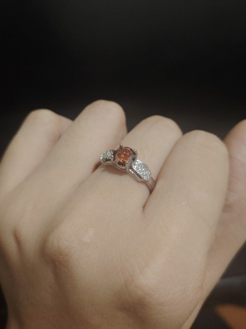 Moissanite Deep Orange colored ring (Category: Rings) located in Caloocan City. Submitted by cherishedfinds (Listing ID 1466429922, Image 2). Description: - Tested Moissanite ring (pass diamond tester) - Adjustable - 18K White Gold plated - 550 each 😍 - Perfect for dummy engagement/wedding ring - Spend 500, get a freebie 🎁 You may add items from my other listings 💯.