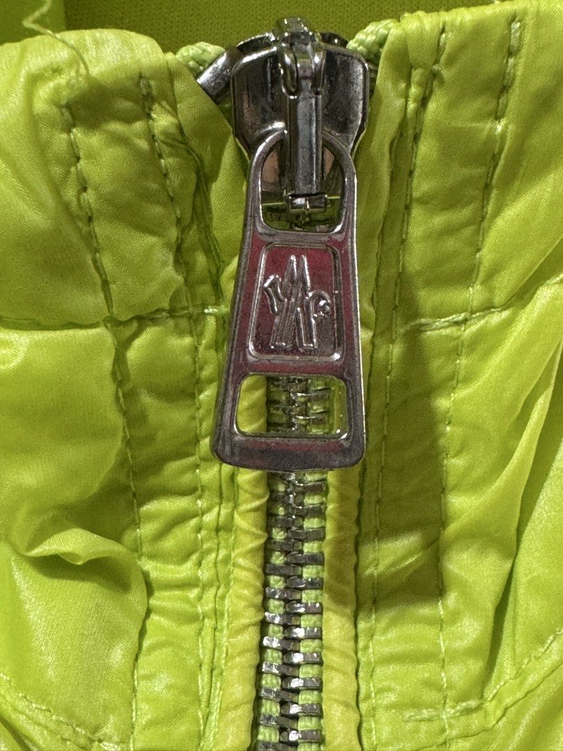 Moncler 100% Original (Category: Luxury Apparel) located in Manila. Submitted by wildbear.e10374 (Listing ID 1466411715, Image 2). Description: - Authentic Moncler neon yellow windbreaker jacket - Size: 4 (tag attached) - Features a built-in hood and full front zipper with branded logo hardware - Iconic tricolor badge patch on the chest - Lightweight and easily packable design - Interior care labels fully intact - Made in Italy.