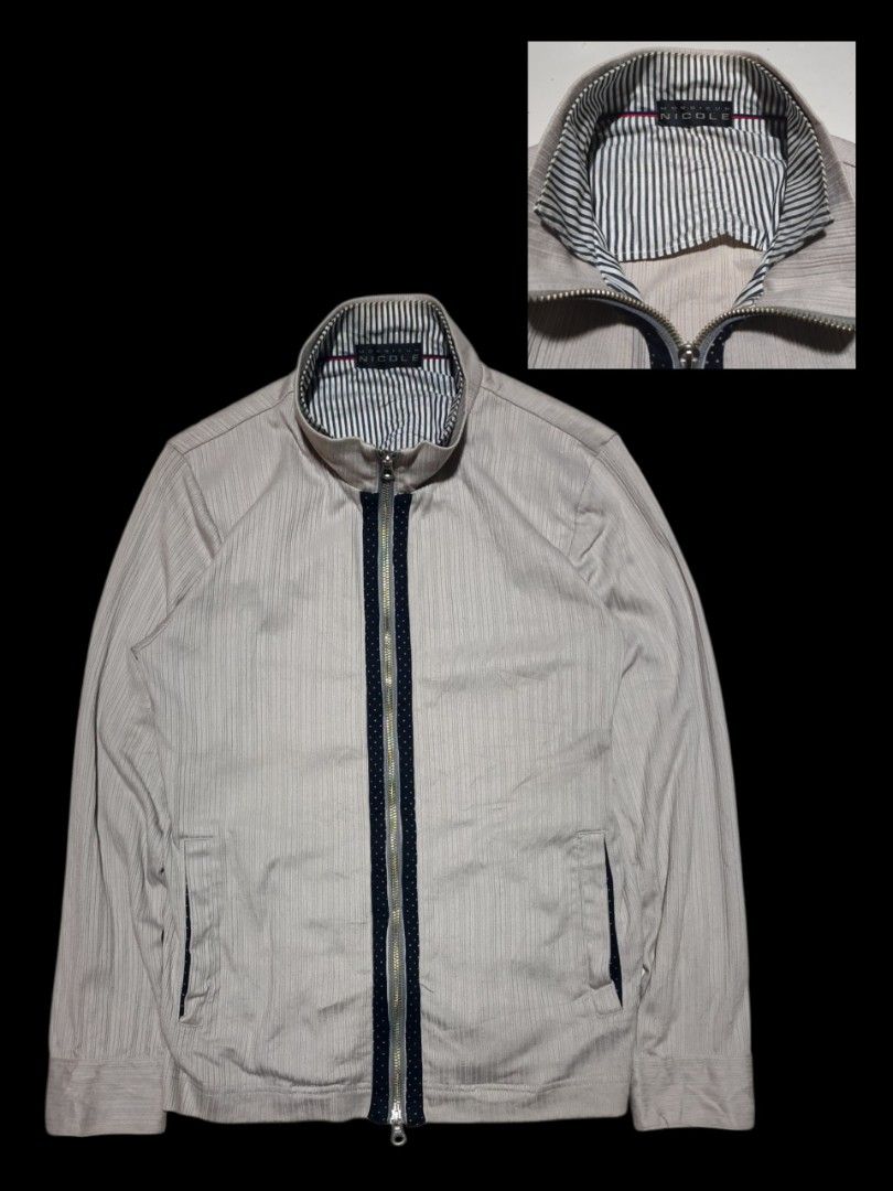 Monsieur Nicole Zip-Up Jacket (Category: Coats, Jackets and Outerwear) located in Calabanga. Submitted by bekneegear (Listing ID 1466482271, Image 1). Description: - Brand/Model: Monsieur Nicole light grey zip-up jacket - Collar: High collar lined with stylish blue and white stripes - Details: Chic dark blue polka dot trim along the front zipper - Pockets: Two functional side pockets with matching polka dot lining - Closure: Full-zip front equipp