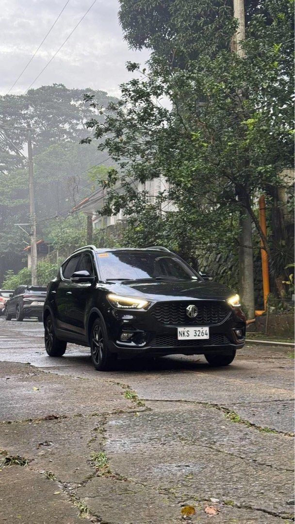 Morris Garage ZS MCE LUX Auto (Category: Used Cars) located in Manila. Submitted by quality_cars (Listing ID 1466527151, Image 2). Description: FOR SALE ONLY ( NO TRADES ) Morris Garage ZS MCE LUX ( A/T ) 2024 model - Black 10k+ mileage ( Casa Maintained ) Price: ₱595,000 ( BIG SAVINGS ) - With 2 Original Keys - With Manual and Booklet - Mags casa marking still intact - Interior and Exterior can be pass as brandnew - No hidden issues, Gas and go.