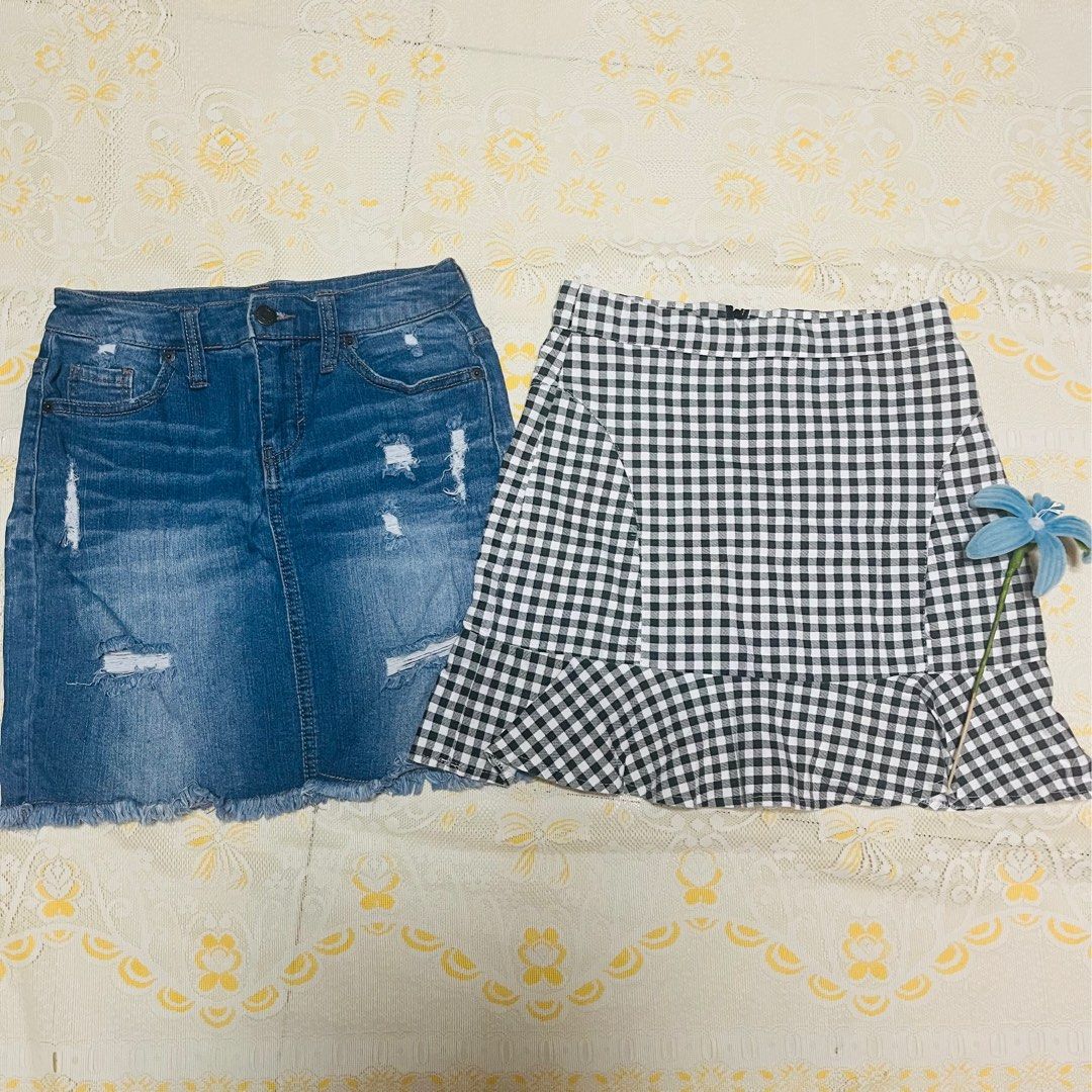 Mossimo denim skirt and black white gingham skirt bundle (Category: Skirts) located in Quezon City. Submitted by rie.g (Listing ID 1466482571, Image 1). Description: - Bundle of 2 trendy casual skirts - Skirt 1: Mossimo denim skirt with cool distressing and raw hem, Size 2/26, comfortable cotton-spandex blend - Skirt 2: Classic black and white gingham check pattern with convenient built-in shorts underneath for safety - Perfect mix-and-match piec