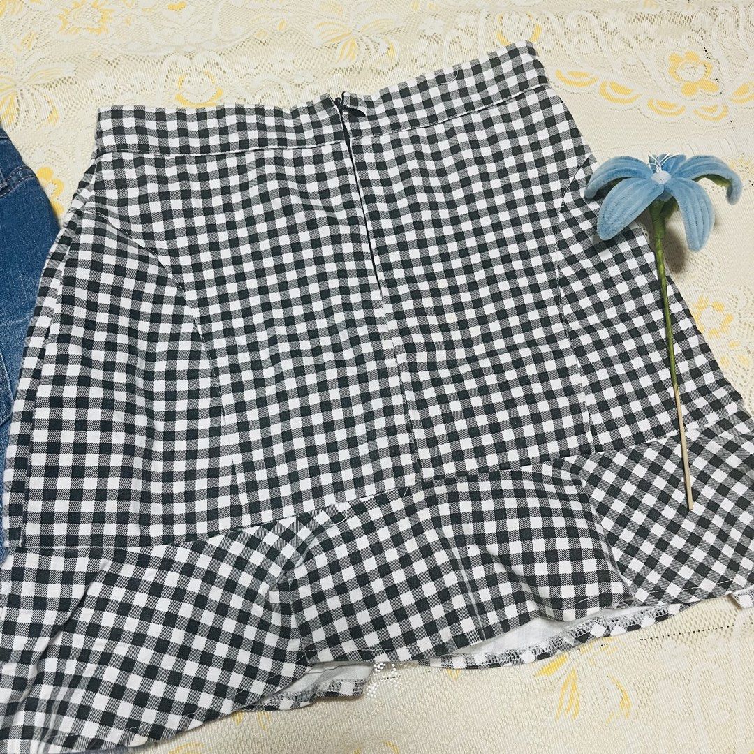 Mossimo denim skirt and black white gingham skirt bundle (Category: Skirts) located in Quezon City. Submitted by rie.g (Listing ID 1466482571, Image 3). Description: - Bundle of 2 trendy casual skirts - Skirt 1: Mossimo denim skirt with cool distressing and raw hem, Size 2/26, comfortable cotton-spandex blend - Skirt 2: Classic black and white gingham check pattern with convenient built-in shorts underneath for safety - Perfect mix-and-match piec