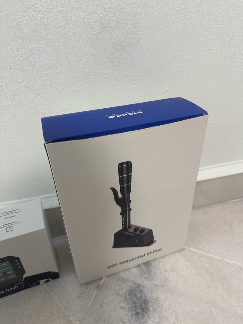 MOZA SGP Sequential Shifter (Category: Controllers) located in Kuala Lumpur. Submitted by tjjl190 (Listing ID 1466518656, Image 1). Description: - Item: MOZA SGP Sequential Shifter (Sim Racing) - Condition: Excellent, comes in original box packaging - Build: Premium real metal construction with customisable damping - Features: RGB buttons, perfect for rally and sequential racing games - Reason for sale: Sitting around unused - Delivery: Ready for