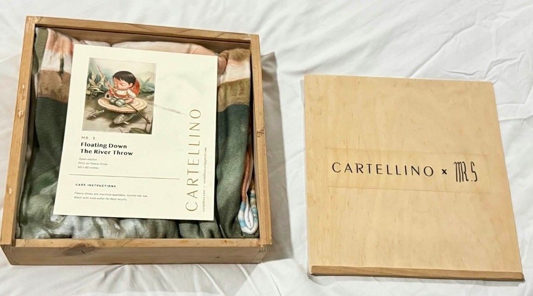 Mr S x Cartellino Floating Down The River Throw (Category: Bedding & Towels) located in Manila. Submitted by bestdealart (Listing ID 1466527738, Image 1). Description: - Collaboration: Cartellino x Mr. S limited release - Design: 'Floating Down The River' full-print artwork - Size: 60 x 80 inches - Material: Warm, ultra-soft fleece throw - Packaging: Comes in a custom wooden keepsake box with a branded sliding lid.