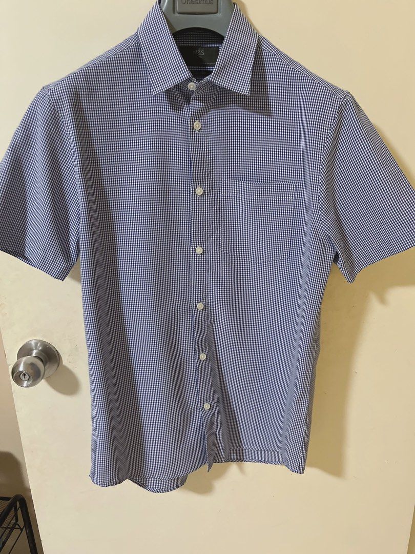 M&S Blue Gingham Short Sleeve Shirt Size S (Category: Tshirts & Polo Shirts ) located in Manila. Submitted by _preciousfinds.2 (Listing ID 1466516650, Image 1). Description: - Brand: Marks & Spencer (M&S) - Design: Blue and white gingham check pattern - Size: S - Features: Short sleeves, classic button-down front, single chest pocket - Material: Easy-care fabric.