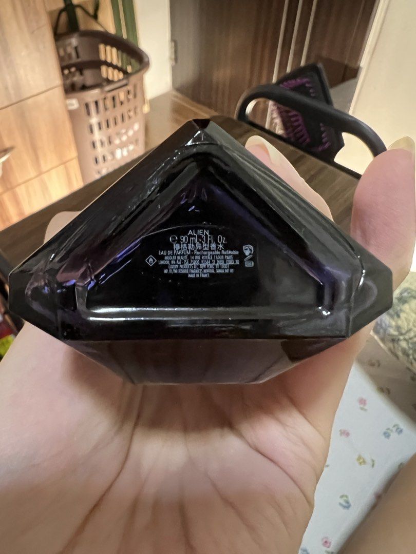 Mugler Alien Eau de Parfum 90ml (Category: Fragrance & Deodorants) located in Antipolo. Submitted by xydln (Listing ID 1466468304, Image 3). Description: - Authentic Mugler Alien Eau de Parfum - Large 90ml refillable bottle in iconic purple crystal design - Batch code: 38X90214 (visible near top collar) - Condition: Like new, missing about 5-10ml - Fragrance profile: Powerful woody floral amber with distinct jasmine notes.