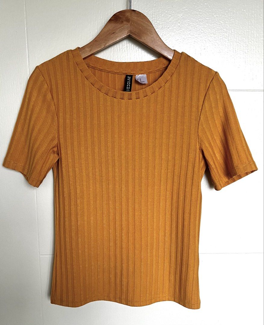 Mustard Ribbed Knit Top (Category: Blouses) located in Pasig City. Submitted by jsyrgt (Listing ID 1466427412, Image 1). Description: Condition: 8/10 Has a minor snag at the back (encircled in the last photo). Fit: Fitted, casual everyday basic with a round neckline Styling: Looks perfect with high-waisted denim Color: Mustard Yellow MOP: MariBank QR RFS: wardrobe update *Actual color may vary slightly due to lighting and screen settings.