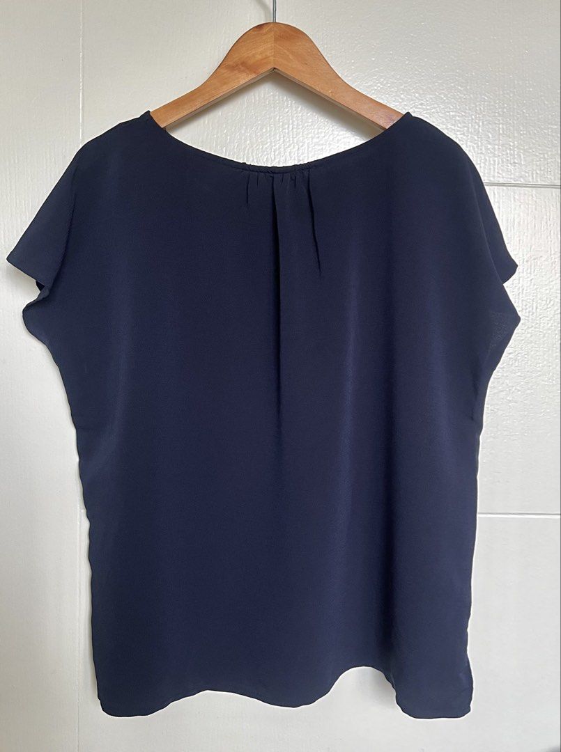 Navy Blue Boxy Blouse (Category: Blouses) located in Pasig City. Submitted by jsyrgt (Listing ID 1466420187, Image 2). Description: Condition: 10/10 Lightweight material, easy to match with skirts or trousers for work or casual outings. Color: Navy Blue MOP: MariBank QR RFS: wardrobe update *Actual color may vary slightly due to lighting and screen settings .
