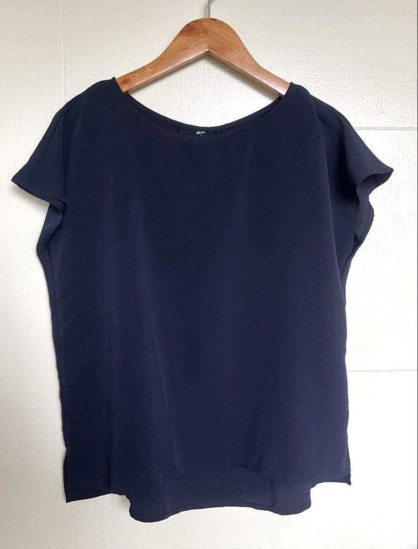 Navy Blue Boxy Blouse (Category: Blouses) located in Pasig City. Submitted by jsyrgt (Listing ID 1466420187, Image 1). Description: Condition: 10/10 Lightweight material, easy to match with skirts or trousers for work or casual outings. Color: Navy Blue MOP: MariBank QR RFS: wardrobe update *Actual color may vary slightly due to lighting and screen settings .