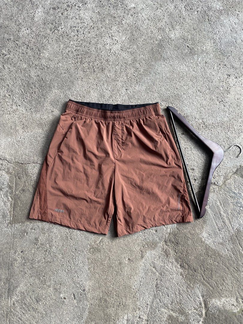 NEPA Performance Lab Brown Athletic Shorts (Category: Shorts) located in General Santos City (Dadiangas). Submitted by christbluee (Listing ID 1466559914, Image 1). Description: - Brand: NEPA Performance Lab - Color: Earth brown with black contrast inner waistband - Material: Lightweight, stretchable fabric - Mobility: Side stretch panels for easy movement - Storage: Convenient back zipper pockets - Best for: Workouts, running, and outdoor hiking