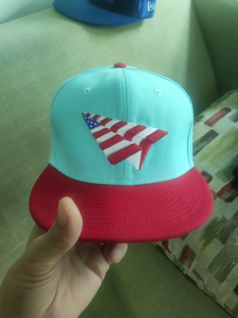 New Era 9FIFTY Paper Plane Snapback Cap (Category: Caps & Hats) located in Pasay City. Submitted by wizemindz138970 (Listing ID 1466531459, Image 1). Description: - Mint green crown with a contrasting red flat brim - Embroidered American flag paper plane graphic on the front - Classic New Era flag embroidery on the side - Adjustable white snapback closure - Interior branded taping with 9FIFTY branding - Clean condition, no stains or damage 800 on