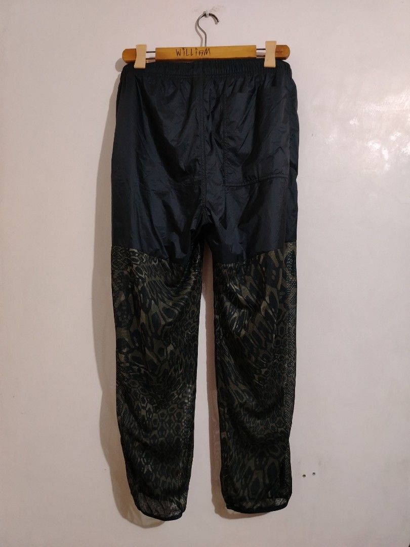 Nike ACG Dri-Fit Leopard Print Pants (Category: Joggers) located in Cavite. Submitted by koyawell.ph (Listing ID 1466408534, Image 2). Description: - Brand: Nike ACG - Size large - 39 length - Style: Track pants with olive green and black solid panels - Design: All-over leopard print mesh material - Performance: Dri-Fit technology to keep you dry and comfortable - Fit: Elastic waistband with adjustable drawstring, Size Large - Origin: Made in Vie