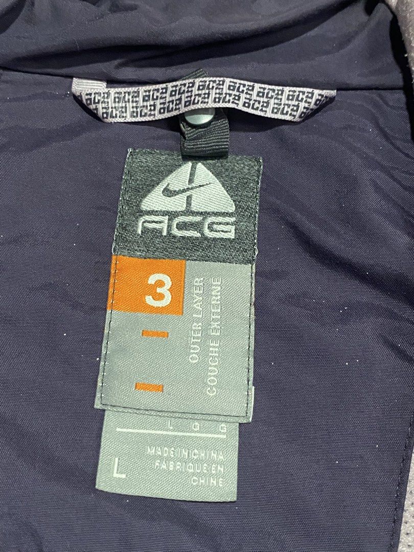 Nike ACG Triple Layer Hooded Jacket Purple Size L (Category: Coats, Jackets and Outerwear) located in Baguio. Submitted by yunothewizardking (Listing ID 1466440637, Image 3). Description: - Brand: Nike ACG - Color: Purple - Size: L (165/88A) - Material: Nylon outer shell with polyester upper lining - Closure: Full zip front with attached hood - Fit/Adjustability: Adjustable drawstrings at waist and hem - Features: Inner elastic powder skirt, mult