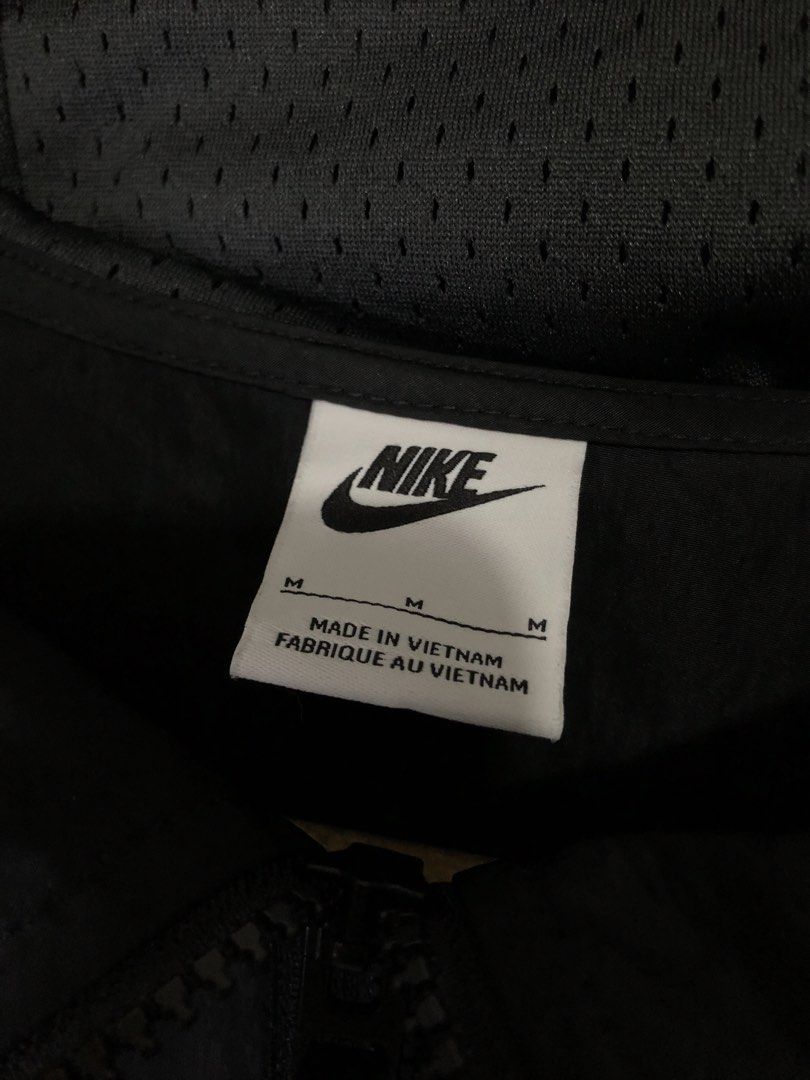 Nike Air Black Grey Anorak Windbreaker Jacket (Category: Coats, Jackets and Outerwear) located in Quezon City. Submitted by clarizedeo09960 (Listing ID 1466500480, Image 2). Description: - Brand: Nike Air - Style: Anorak windbreaker jacket - Color: Black and grey - Size: Medium (chest width 95cm) - Material: Body 73% polyester, 27% nylon with mesh lining - Origin: Made in Vietnam - Features: Half-zip closure, hooded design with adjustable hem dra