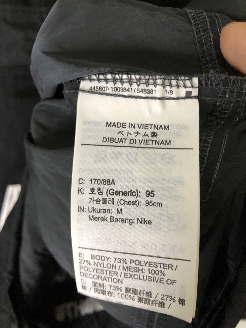Nike Air Black Grey Anorak Windbreaker Jacket (Category: Coats, Jackets and Outerwear) located in Quezon City. Submitted by clarizedeo09960 (Listing ID 1466500480, Image 3). Description: - Brand: Nike Air - Style: Anorak windbreaker jacket - Color: Black and grey - Size: Medium (chest width 95cm) - Material: Body 73% polyester, 27% nylon with mesh lining - Origin: Made in Vietnam - Features: Half-zip closure, hooded design with adjustable hem dra