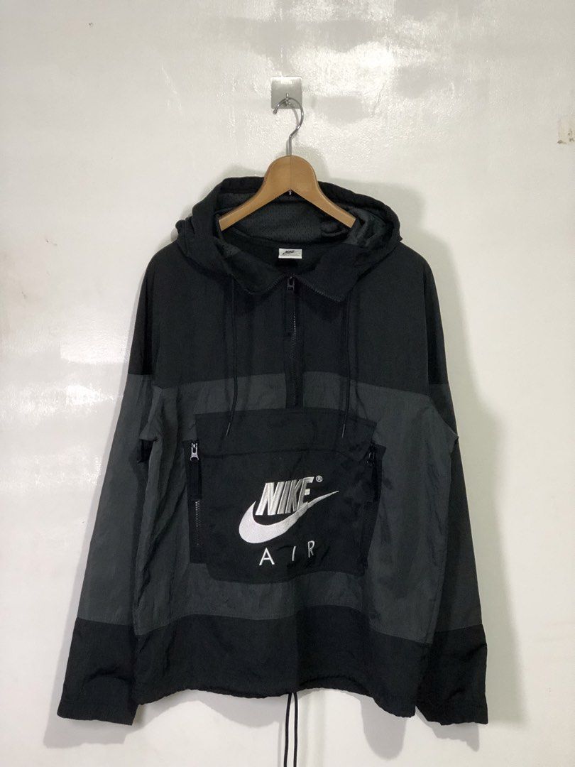 Nike Air Black Grey Anorak Windbreaker Jacket (Category: Coats, Jackets and Outerwear) located in Quezon City. Submitted by clarizedeo09960 (Listing ID 1466500480, Image 1). Description: - Brand: Nike Air - Style: Anorak windbreaker jacket - Color: Black and grey - Size: Medium (chest width 95cm) - Material: Body 73% polyester, 27% nylon with mesh lining - Origin: Made in Vietnam - Features: Half-zip closure, hooded design with adjustable hem dra