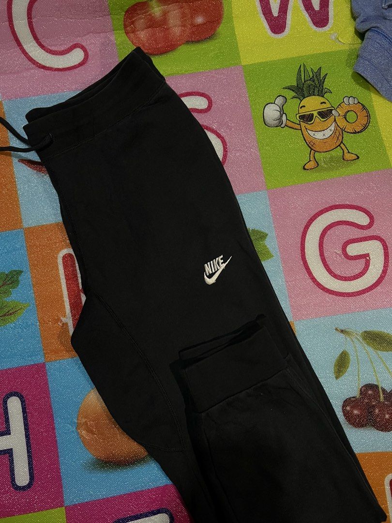 Nike Black Sweatpants Joggers Size XL (Category: Joggers) located in Manila. Submitted by kayee.3 (Listing ID 1466495872, Image 3). Description: - Brand: Nike - Color: Black with white drawstrings and stacked leg logos - Size: XL - Material: Comfortable and breathable cotton blend - Features: Elastic waistband, ribbed cuffs, and a secure zippered side pocket - Condition: Great for workouts, running errands, or lounging at home - Shipping: Fast sh