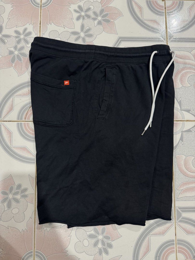 Nike Black Sweatshorts with Large Logo Print (Category: Shorts) located in Ilagan. Submitted by roedaggara99309 (Listing ID 1466478585, Image 2). Description: Super comfy black Nike sweatshorts featuring bold white lettering, an adjustable drawstring waist, and raw edge hems. Includes handy front and back pockets with a classic orange Nike tag. Made from soft cotton. Perfect for casual wear or workouts. Hit Chat to deal!.