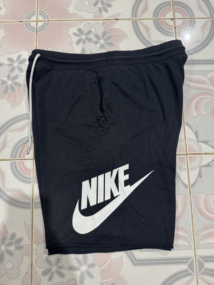 Nike Black Sweatshorts with Large Logo Print (Category: Shorts) located in Ilagan. Submitted by roedaggara99309 (Listing ID 1466478585, Image 1). Description: Super comfy black Nike sweatshorts featuring bold white lettering, an adjustable drawstring waist, and raw edge hems. Includes handy front and back pockets with a classic orange Nike tag. Made from soft cotton. Perfect for casual wear or workouts. Hit Chat to deal!.