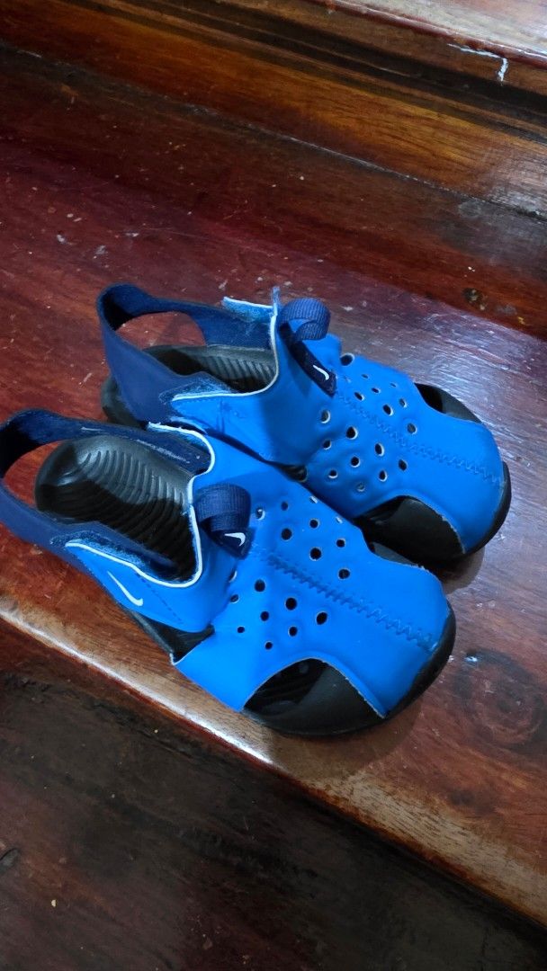 Nike Blue Kids Sandals (Category: Babies & Kids Fashion) located in Valenzuela. Submitted by bella_onez (Listing ID 1466444649, Image 2). Description: - Brand/Model: Nike Kids Sandals - Color: Blue and black - Design: Slip-on with a secure back strap - Comfort & Breathability: Perforated upper material - Sole: Textured footbed and wave-patterned rubber for good grip - Best for: Water activities and casual everyday wear.