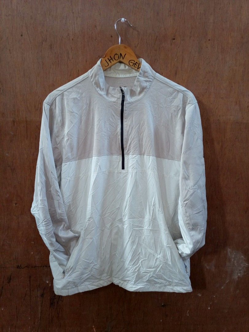 Nike BV0388-221 Half Zip Jacket Size XL (Category: Coats, Jackets and Outerwear) located in Manila. Submitted by jeancharis67207 (Listing ID 1466524304, Image 1). Description: Nike half-zip jacket in a two-tone cream and white colorway. Stand-up collar with a black front zipper. Long sleeves with the black Nike Swoosh logo printed near the cuff. Front pockets with zippers on both sides. Size XL label inside. Product code BV0388-221. Clean fabric 