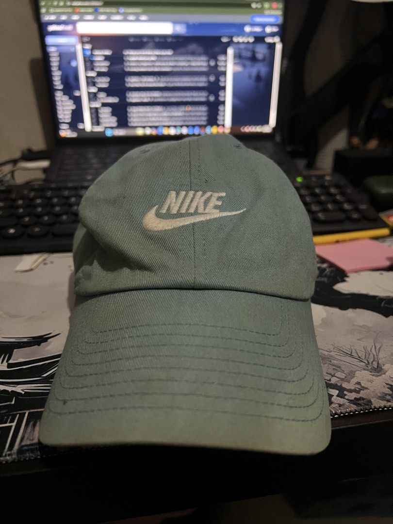 Nike Club Heritage86 strapback cap (Category: Caps & Hats) located in Paranaque City. Submitted by ekkostarfall.12902 (Listing ID 1466507453, Image 1). Description: - Color: Gem - Material: 100% cotton - Closure: Adjustable strapback with metal buckle - Design: Embroidered logo on the front - 100% original - Condition: Noticeable rust-colored staining on the back panel and light wearing along the inner headband RFS: not using anymore, no time to 