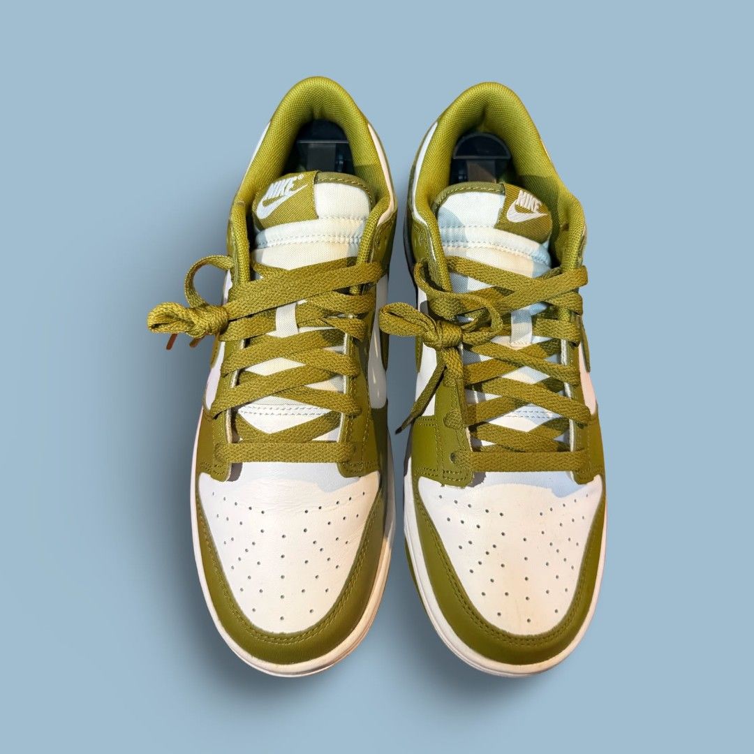 Nike Dunk Low Olive Green White Sneakers (Category: Casual Shoes) located in Del Monte. Submitted by jasonjuan31 (Listing ID 1466498059, Image 1). Description: - Brand/Model: Nike Dunk Low - Colorway: Olive Green and White - Material: Classic leather upper with perforated toe box - Condition: Clean overall with minimal signs of wear - Details: Matching green laces, white midsole, and olive outsole - Style: Versatile streetwear staple.