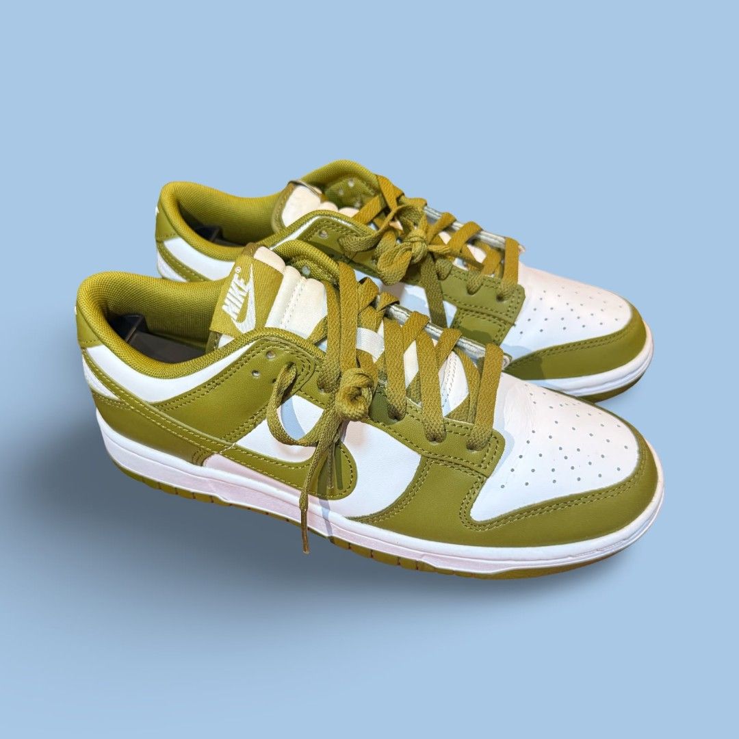 Nike Dunk Low Olive Green White Sneakers (Category: Casual Shoes) located in Del Monte. Submitted by jasonjuan31 (Listing ID 1466498059, Image 2). Description: - Brand/Model: Nike Dunk Low - Colorway: Olive Green and White - Material: Classic leather upper with perforated toe box - Condition: Clean overall with minimal signs of wear - Details: Matching green laces, white midsole, and olive outsole - Style: Versatile streetwear staple.