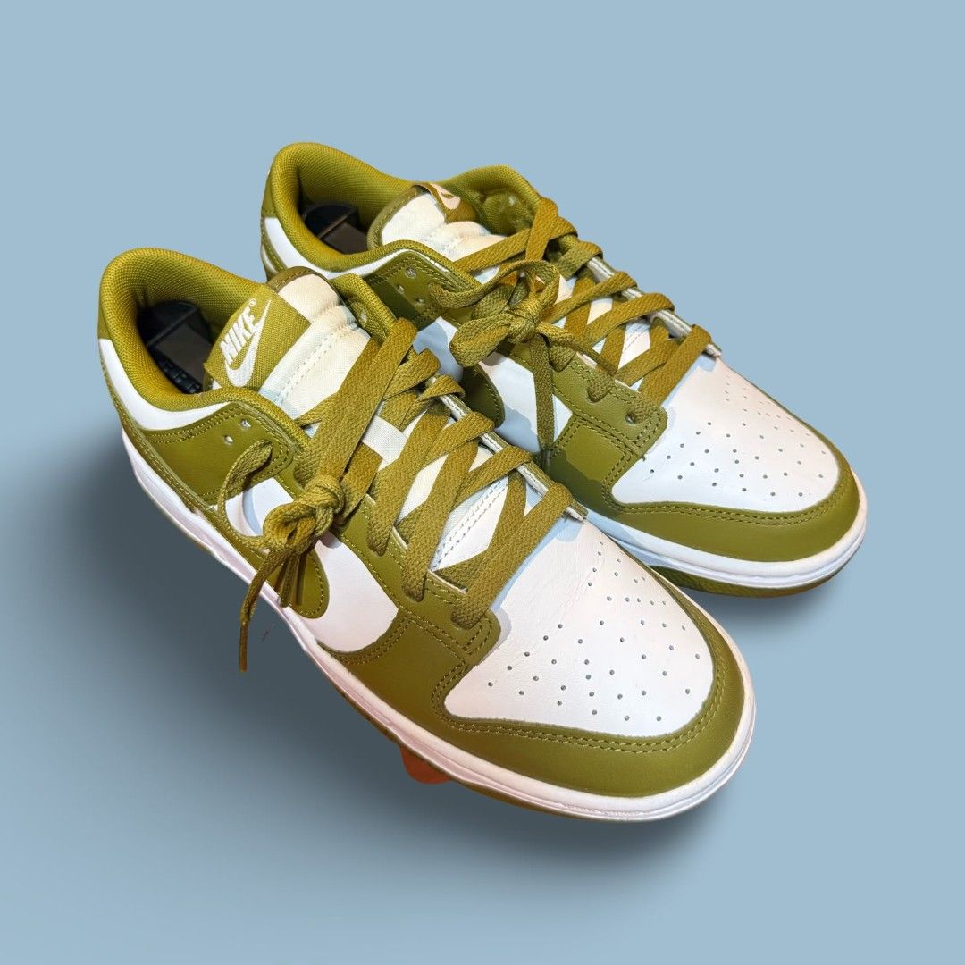 Nike Dunk Low Olive Green White Sneakers (Category: Casual Shoes) located in Del Monte. Submitted by jasonjuan31 (Listing ID 1466498059, Image 3). Description: - Brand/Model: Nike Dunk Low - Colorway: Olive Green and White - Material: Classic leather upper with perforated toe box - Condition: Clean overall with minimal signs of wear - Details: Matching green laces, white midsole, and olive outsole - Style: Versatile streetwear staple.