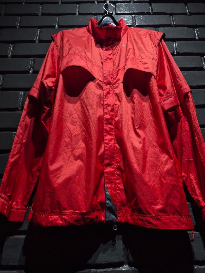 Nike Golf Red Windbreaker Jacket Convertible (Category: Coats, Jackets and Outerwear) located in Davao. Submitted by rodrigoani57168 (Listing ID 1466477487, Image 2). Description: - Brand: Nike Golf - Color: Bright red - Style: Zip-up windbreaker with high collar (convertible to a vest via detachable sleeves) - Size: 23" width x 30" length - Details: Nike Golf logo on back collar, small swoosh on chest - Material: Lightweight and comfortable - Do