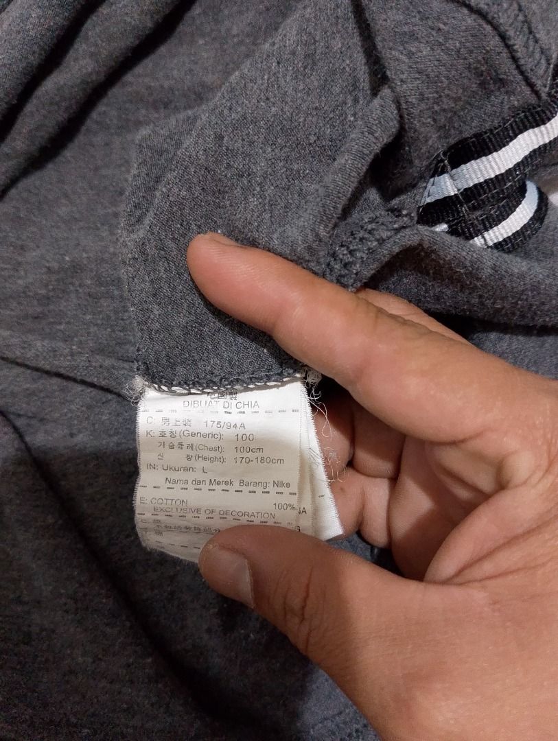 Nike Gray Cotton Polo Shirt Size M (Category: Tshirts & Polo Shirts ) located in Cavite. Submitted by marvzclothing (Listing ID 1466463473, Image 3). Description: - Brand: Nike - Color: Gray - Material: 100% breathable cotton - Size: M (fits height 170-180cm) - Details: Classic button placket, ribbed sleeve cuffs, white embroidered swoosh logo on chest - Condition: Good staple piece - Style: Perfect for casual wear and smart-casual outfits - Mode