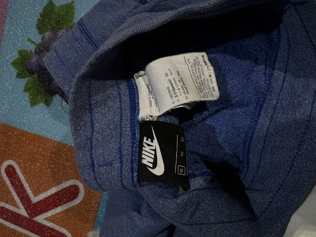 Nike Grey and Blue Shorts Bundle (Category: Shorts) located in Manila. Submitted by kayee.3 (Listing ID 1466495453, Image 3). Description: - 2 pairs of Nike shorts in a bundle - Pair 1: Heather grey, big white letters, lime green swoosh, size Small - Pair 2: Heather blue, white swoosh at hem, size Extra Large - Both feature adjustable drawstrings and side pockets - Material: Soft cotton blend - Ideal for workouts or casual lounging 600 ASPACK!.
