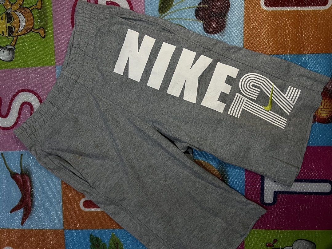 Nike Grey and Blue Shorts Bundle (Category: Shorts) located in Manila. Submitted by kayee.3 (Listing ID 1466495453, Image 2). Description: - 2 pairs of Nike shorts in a bundle - Pair 1: Heather grey, big white letters, lime green swoosh, size Small - Pair 2: Heather blue, white swoosh at hem, size Extra Large - Both feature adjustable drawstrings and side pockets - Material: Soft cotton blend - Ideal for workouts or casual lounging 600 ASPACK!.