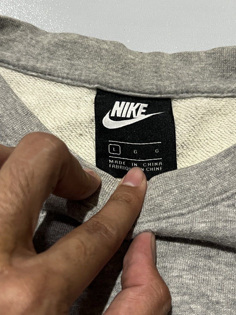Nike Grey Sweatshirt Crewneck Size L (Category: Coats, Jackets and Outerwear) located in Manila. Submitted by ben_101202 (Listing ID 1466476849, Image 3). Description: Nike side logo Large on tag Dimes:24x28 Excellent condition .