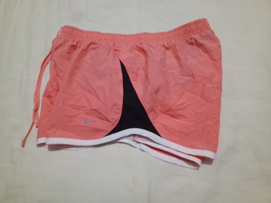 Nike peach Dri-fit shorts (Category: Activewear) located in Santa Maria. Submitted by paulo-garcia21 (Listing ID 1466458010, Image 3). Description: small on tag waist 25 to 31 length 9.5 hem 11.5 no flaws excellent condition.