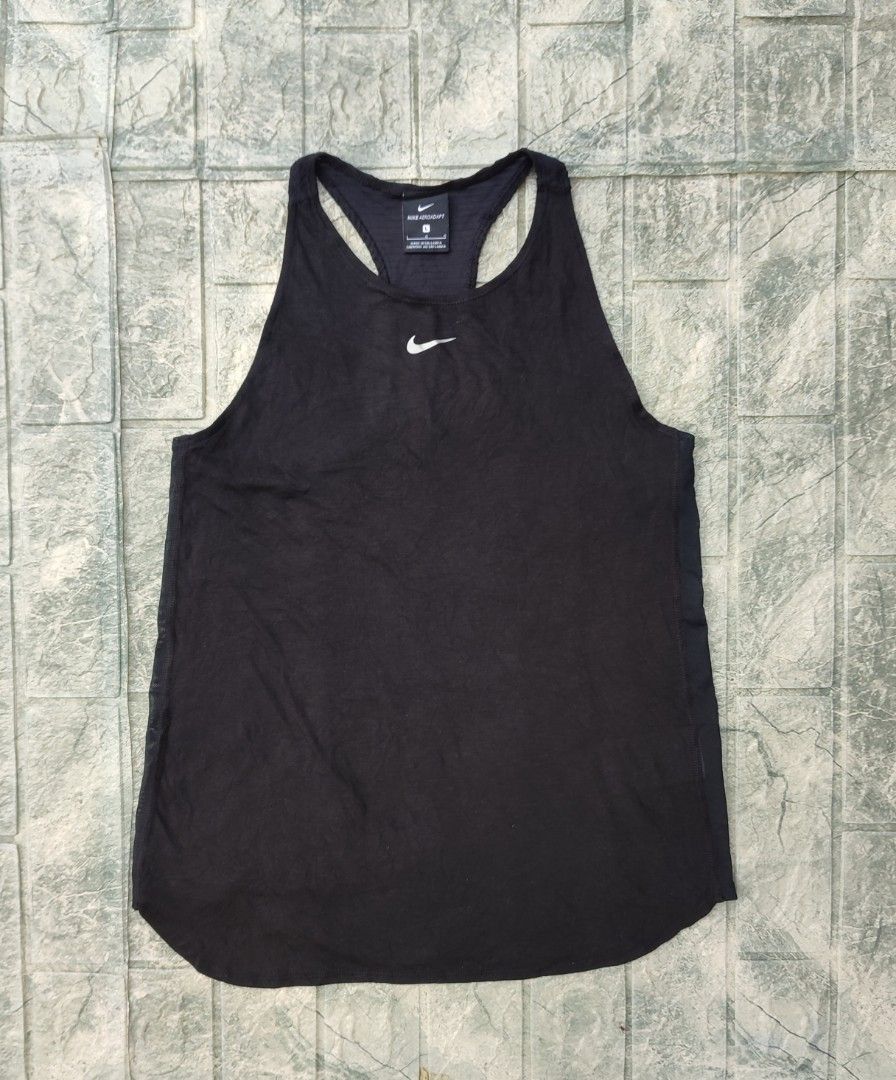 Nike Pro AeroAdapt Women's Training Tank Top (Category: Activewear) located in Bayambang. Submitted by mon10192816 (Listing ID 1466466949, Image 1). Description: - Width 15¾ - Length 23¼ - Brand: Nike - Model: AeroAdapt Training Tank Top (Style CU5717-010) - Color: Black - Size: Large (L) - Material: Body (75% polyester, 13% cotton, 12% rayon), Panels (81% polyester, 19% nylon) - Features: Racerback design, ribbed back panel, and mesh side panels