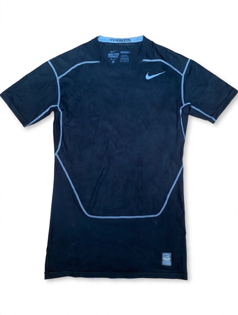 Nike Pro Combat Hypercool Compression Shirt (Category: Activewear) located in Las Pinas. Submitted by john.ross.sayoc.30-82096 (Listing ID 1466391448, Image 1). Description: - Brand: Nike Pro Combat Hypercool - Color: Black with light blue collar lining - Size: Medium (snug athletic fit) - Technology: Dri-FIT moisture-wicking fabric - Ventilation: Breathable mesh panels on front chest and back - Details: Small woven Nike Pro logo patch near botto
