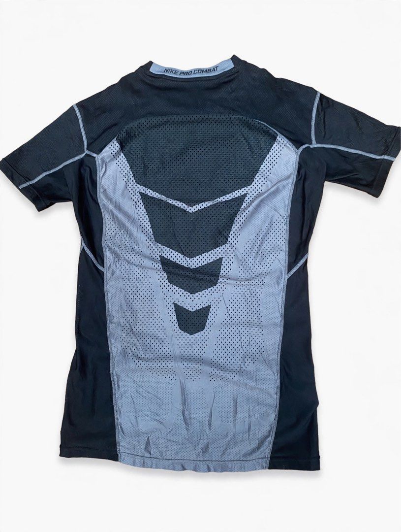 Nike Pro Combat Hypercool Compression Shirt (Category: Activewear) located in Las Pinas. Submitted by john.ross.sayoc.30-82096 (Listing ID 1466391448, Image 2). Description: - Brand: Nike Pro Combat Hypercool - Color: Black with light blue collar lining - Size: Medium (snug athletic fit) - Technology: Dri-FIT moisture-wicking fabric - Ventilation: Breathable mesh panels on front chest and back - Details: Small woven Nike Pro logo patch near botto