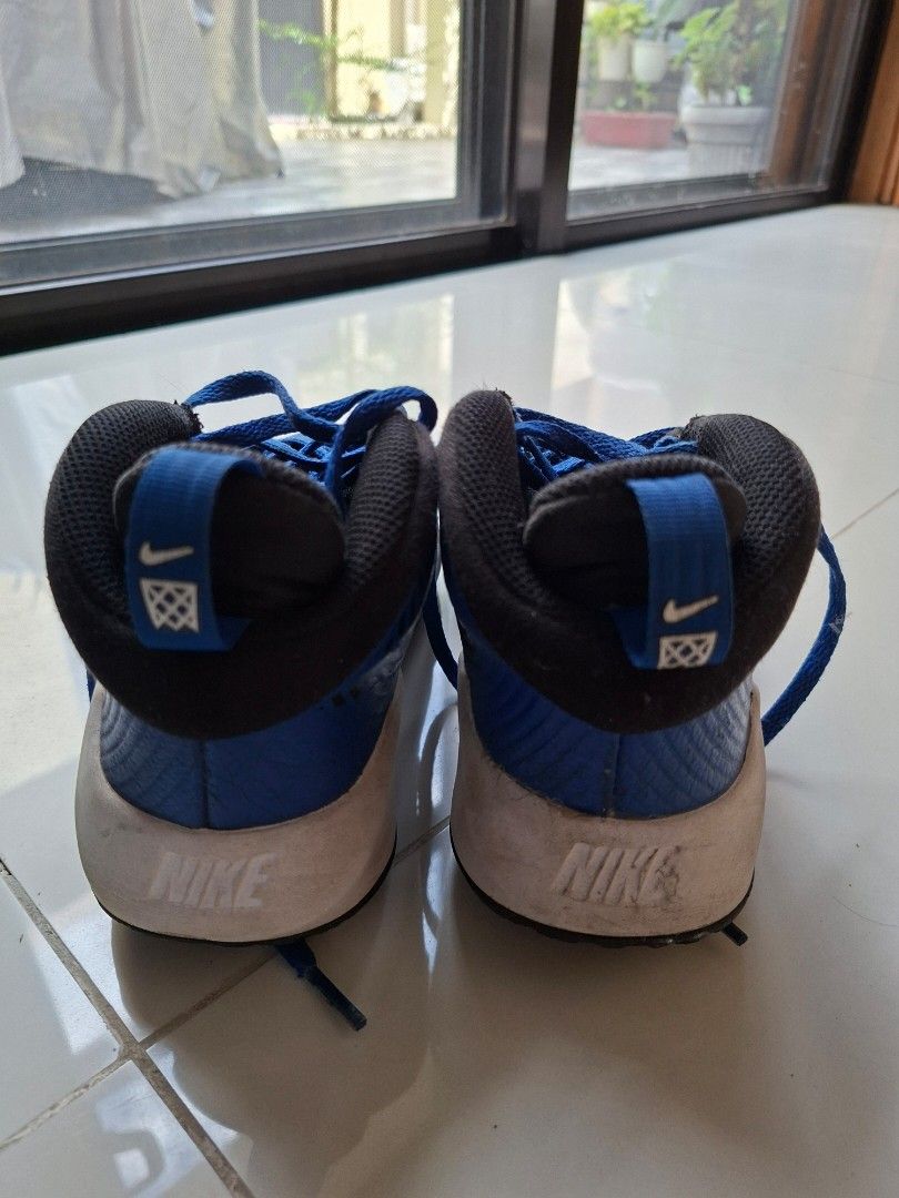 Nike Rubber shoes 23cm (Category: Sneakers) located in Cavite. Submitted by ronelarose (Listing ID 1466381057, Image 3). Description: - Brand: Nike - Model & Style: Youth Basketball Shoes / AQ4224-400 - Colorway: Blue and Black with Bright Blue Laces - Size: US 4Y / UK 3.5 / EUR 36 / CM 23 - Design: Mesh toe box, Nike logo back pull tabs, and white midsoles - Condition: Good pre-loved condition with some wear on the heels - Best For: Basketball p