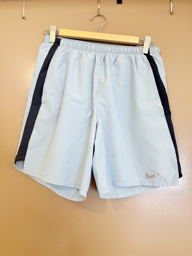 Bundle Nike Running Dri-FIT Shirt and Shorts Set (Category: Activewear) located in Quezon City. Submitted by slowpopanda (Listing ID 1466429982, Image 3). Description: - Brand: Nike - Selling as a bundle - 2 dri-fit shirts - 2 shorts - Size: Medium - Colorway: Shirt 1 Grey and white with large Nike chest graphic Shirt 1 red with white Nike logo Shorts 1 Light and Dark Blue with Grey logo Shorts 2 Grey with Grey logo - Material: Breathable mesh fa