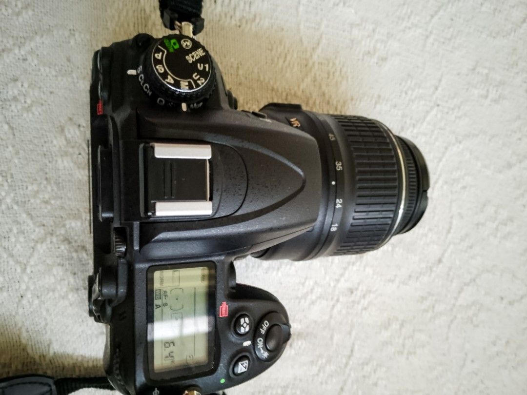 Nikon D7000 DSLR Camera with 18-55mm Lens (Category: Cameras) located in Caloocan City. Submitted by psalmerth.mountain (Listing ID 1466469539, Image 1). Description: - Nikon D7000 digital SLR camera body with AF-S DX Nikkor 18-55mm f/3.5-5.6G VR lens - Includes original neck strap and lens cap - Clean LCD screen and fully working menu functions - Intact rubber grips on body and zoom ring - Standard hot shoe mount and working built-in flash - Bat