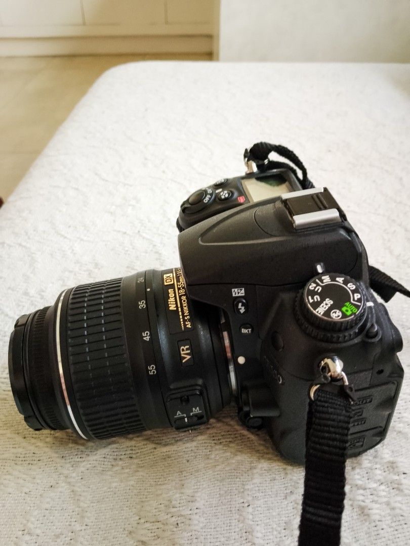 Nikon D7000 DSLR Camera with 18-55mm Lens (Category: Cameras) located in Caloocan City. Submitted by psalmerth.mountain (Listing ID 1466469539, Image 2). Description: - Nikon D7000 digital SLR camera body with AF-S DX Nikkor 18-55mm f/3.5-5.6G VR lens - Includes original neck strap and lens cap - Clean LCD screen and fully working menu functions - Intact rubber grips on body and zoom ring - Standard hot shoe mount and working built-in flash - Bat