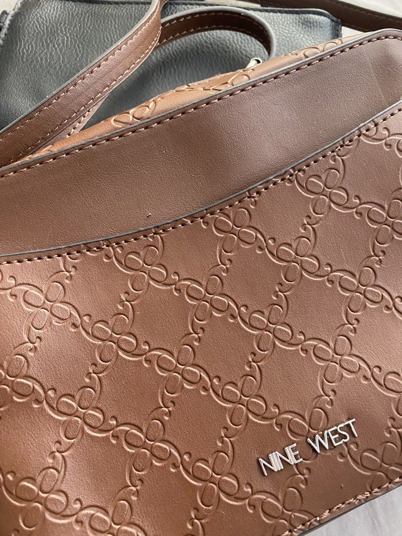 Nine West Brown Embossed Monogram Crossbody Bag (Category: Cross-body Bags) located in Manila. Submitted by mpt99876 (Listing ID 1466521266, Image 2). Description: - Authentic Nine West crossbody bag in a stylish brown hue. - Features a sophisticated all-over embossed monogram pattern. - Secure zip-top closure to keep your belongings safe. - Interior includes a convenient zip pocket and a slip pocket for organization. - Adjustable strap for comfo