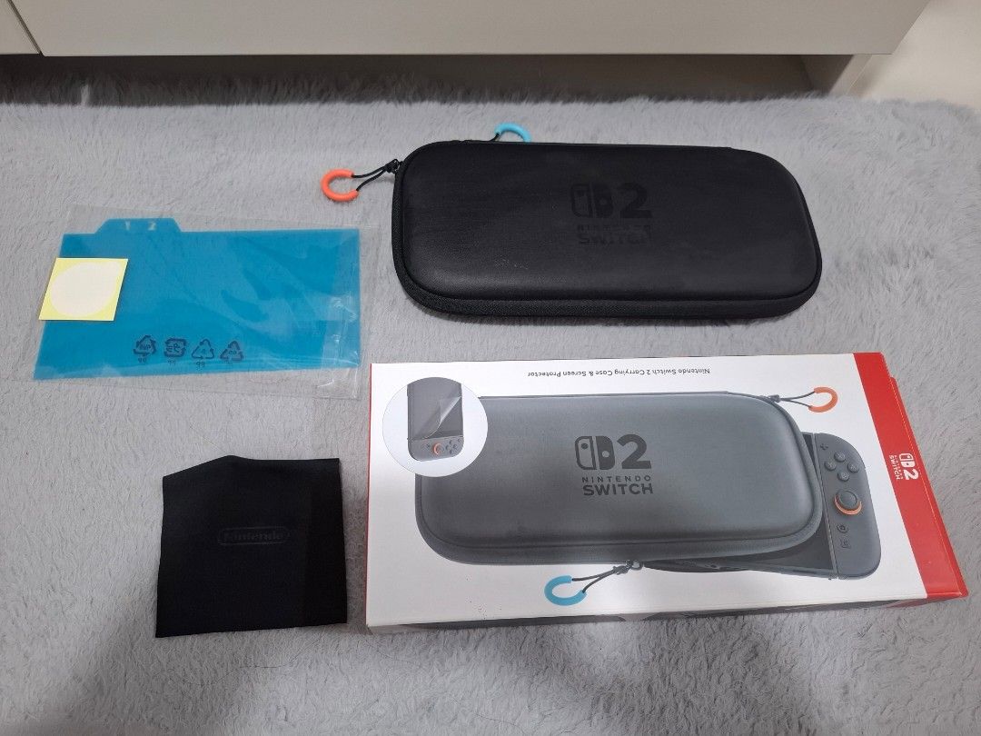 Nintendo Switch 2 Carrying Case & Screen Protector (Category: Cases & Covers) located in Manila. Submitted by beedle2009 (Listing ID 1466463385, Image 1). Description: Original Nintendo Switch 2 case Includes original retail box, black cleaning cloth, and unopened screen protector .