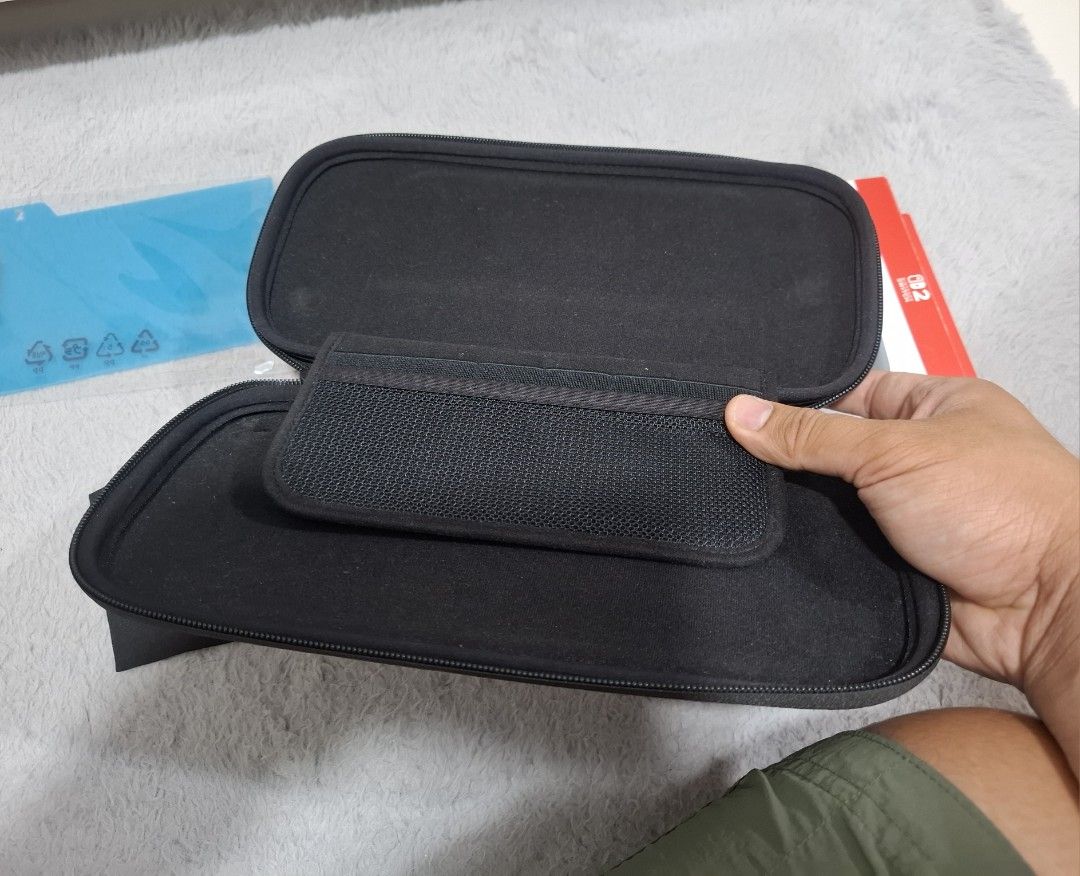 Nintendo Switch 2 Carrying Case & Screen Protector (Category: Cases & Covers) located in Manila. Submitted by beedle2009 (Listing ID 1466463385, Image 2). Description: Original Nintendo Switch 2 case Includes original retail box, black cleaning cloth, and unopened screen protector .