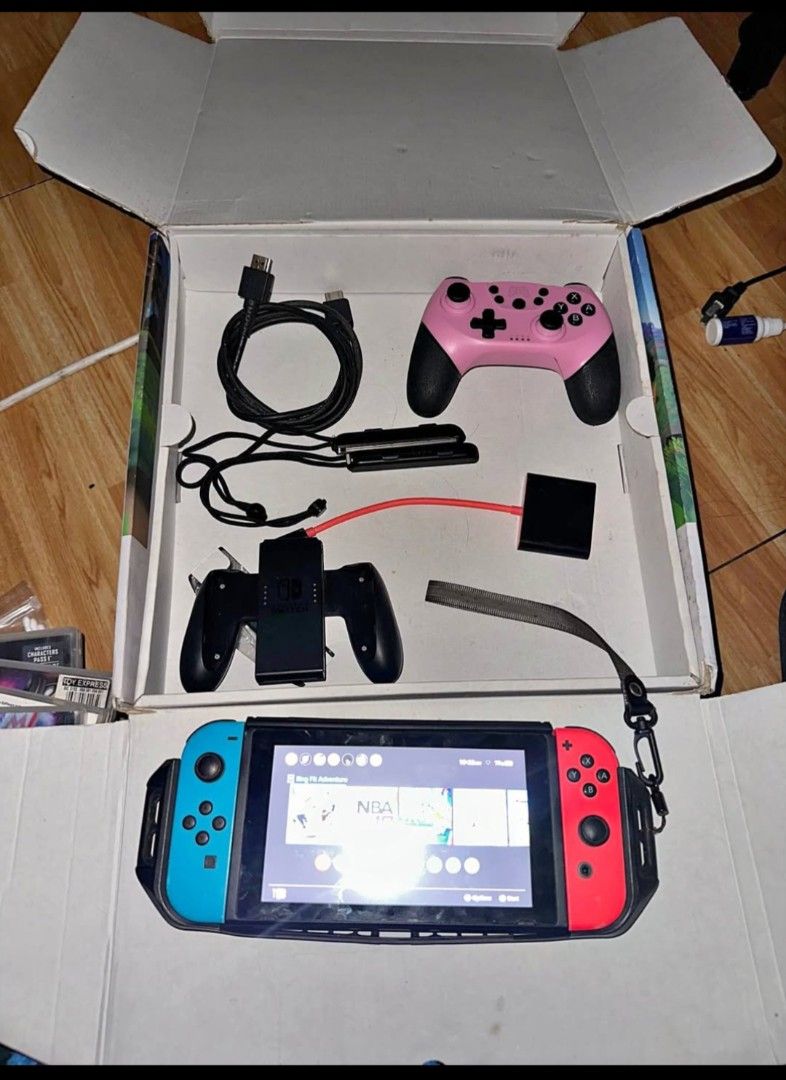 Nintendo Switch Ring Fit Adventure Set with Extra Controller (Category: Nintendo) located in Manila. Submitted by kiraaaaaaaaaaa (Listing ID 1466376344, Image 2). Description: - Nintendo Switch console bundle in great working condition - Includes Ring Fit Adventure complete set - Extra pink wireless controller included - Comes with all cables, joy-con grip, and straps - Original box included - Serial number verified in system settings - Ready to 