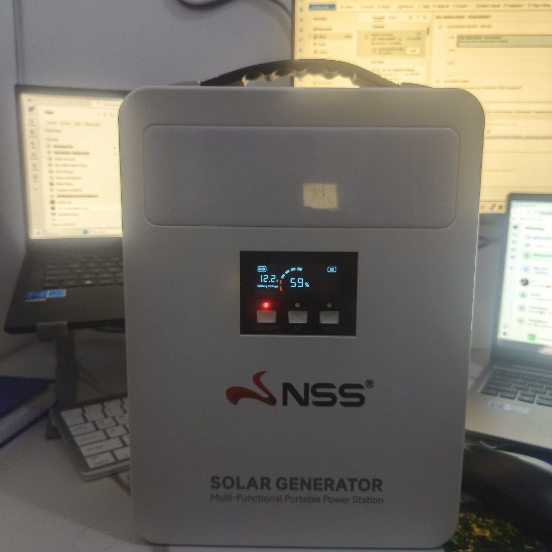 NSS Solar Generator Multi-Functional Portable Power Station (Category: Electrical, Adaptors & Sockets) located in Caloocan City. Submitted by leoregidor11 (Listing ID 1466433158, Image 2). Description: - Brand: NSS Solar Generator Unit - Color: Clean white portable casing with top carrying handle - Display: Digital screen showing 12.2V battery voltage and 59% charge level - Controls: Physical buttons for power, AC, and built-in LED functions - Po