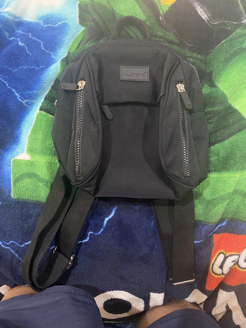 NuPrene Raya Black Mini Backpack (Category: Backpacks) located in Makati City. Submitted by jdeep9 (Listing ID 1466387768, Image 1). Description: Likely new. Never used. No issue. Zipper all working..