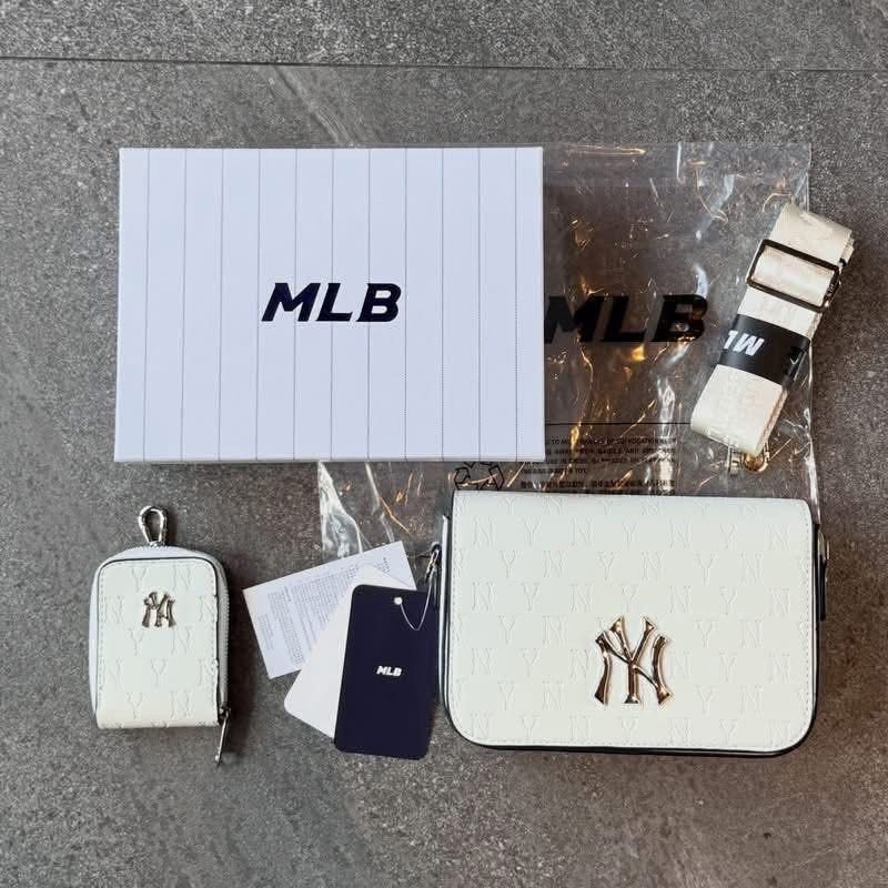 NY MLB Monogram Sling Bag (Category: Sling Bags) located in Manila. Submitted by hatline_co. (Listing ID 1466348514, Image 1). Description: NY MLB Mońoğram Sling bag Comes with Sling coin purse, MLB KOREA HARD BOX With hangtags Adjustable strap Inner pocket Inner 1zip SALE!!.